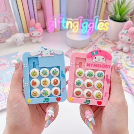 Orange and purple handheld sliding number puzzles