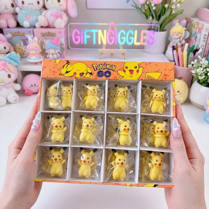 Several small yellow Pikachu character erasers with different expressions on a white desk