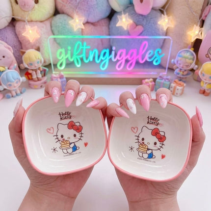 Single rounded square Hello Kitty bowl with pink rim and character illustration inside