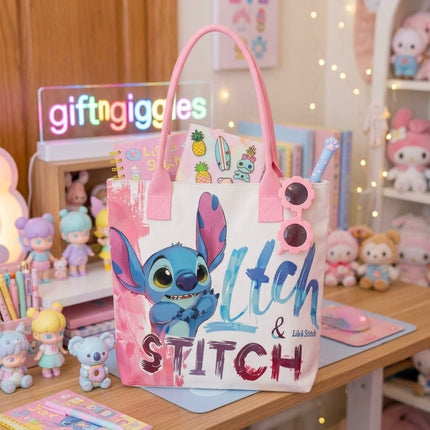 Light-coloured Stitch tote bag with pink handles and large blue Stitch character front print