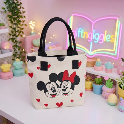 Light-coloured Mickey and Minnie Mouse tote bag with red hearts and black handles