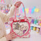 Pink and cream tote bag with Tom and Toodles Galore inside a heart and Tom and Jerry logo