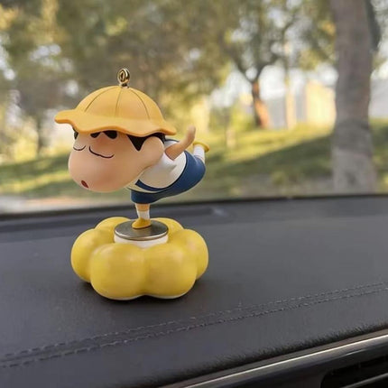Shinchan character dashboard figure in yellow hat on yellow cloud base