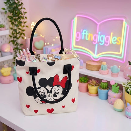 Mickey and Minnie tote bag showing open top and black handles with styling props inside